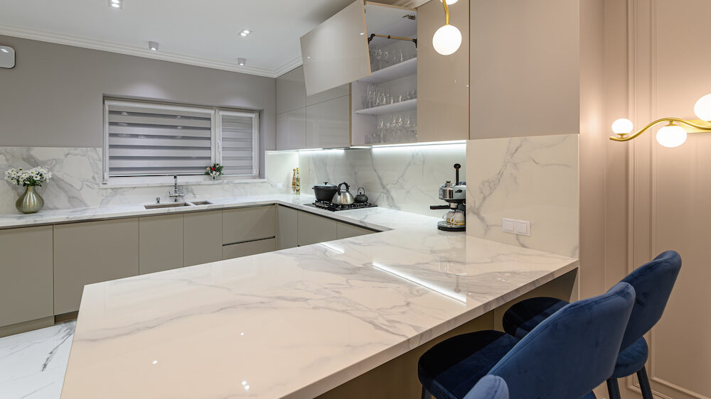 Luxury large modern white marble kitchen united with dining room